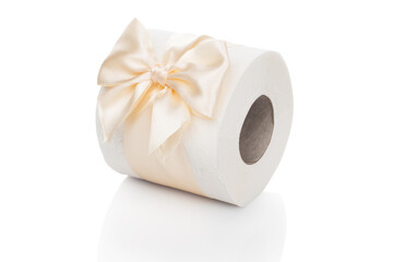 Toilet paper. A roll of white toilet paper tied with a beautiful light bow lies on a white isolated background. Funny gift concept. Present upon purchase.