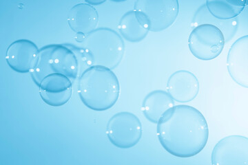 Soap Bubbles Floating on Blue Background. Soap Sud Bubbles Water.