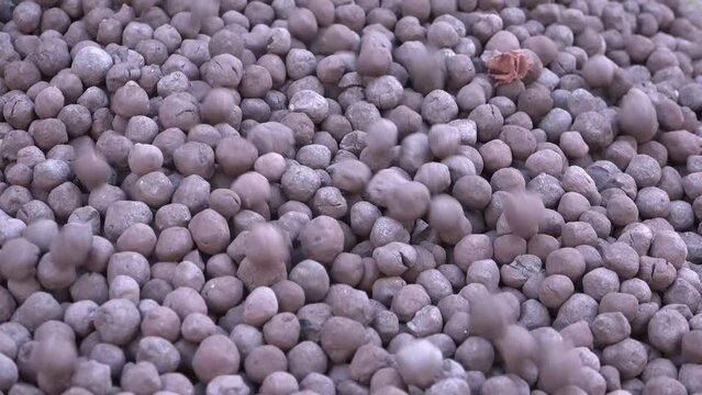 Enriched iron ore finished products warehouse, close up