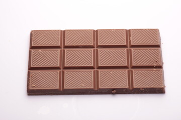 Milk chocolate bar isolated on white background from top view
