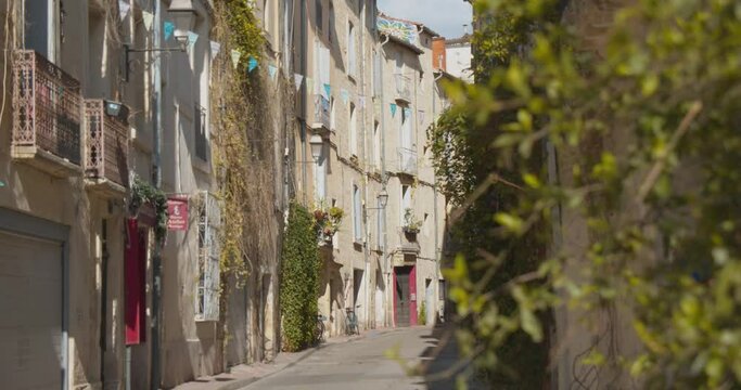 Typical Alleyway In Medieval Streets Of Montpellier In France. Slide Shot