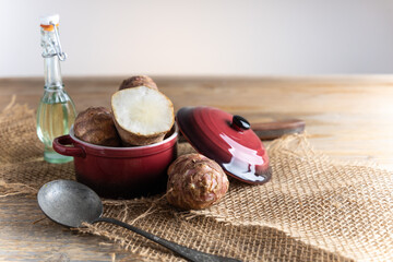 Trendy Winter vegetable. Jerusalem artichoke one of the forgotten vegetables who has become trendy again, on a wooden table.