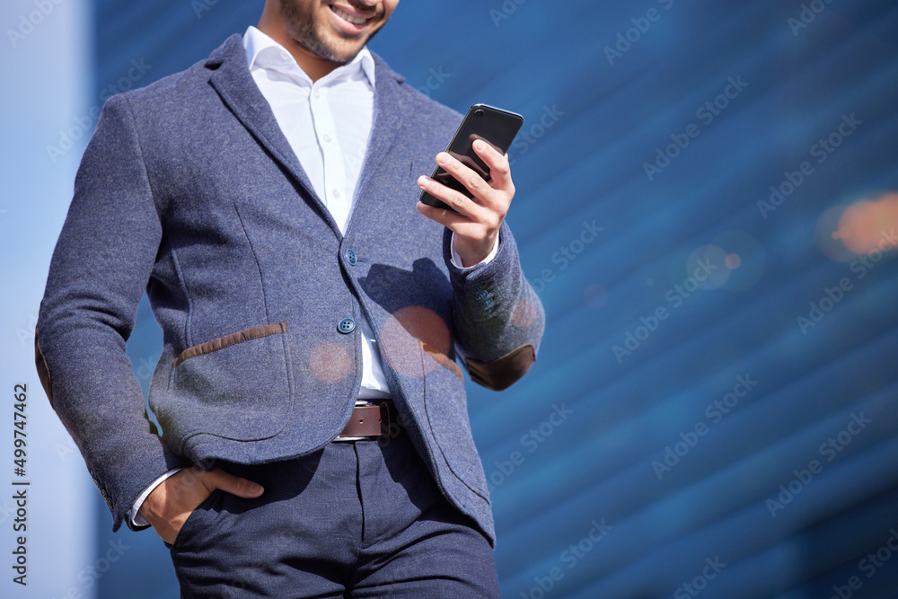 Poster beware of the impact of your words. shot of a businessman using his smartphone to send a text.