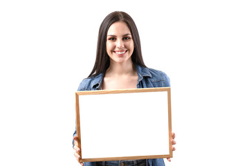 Happy smiling woman holding a placard on a white background in the studio. A beautiful girl shows...