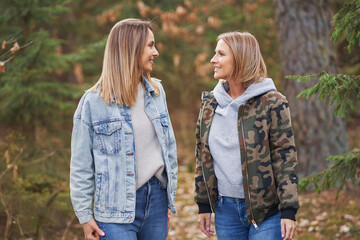 Fototapeta premium Two girl friends or lgnt couple in wood