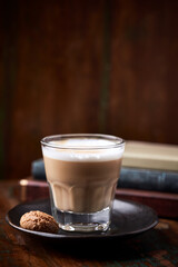 Coffee with milk on rustic wooden background. Soft focus. Close up. Copy space.	