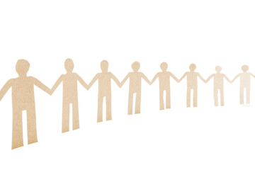 Paper human doll holding hands in a row. Unity concept. Team work and co-workers. Strong togetherness. Solidarity collaboration.