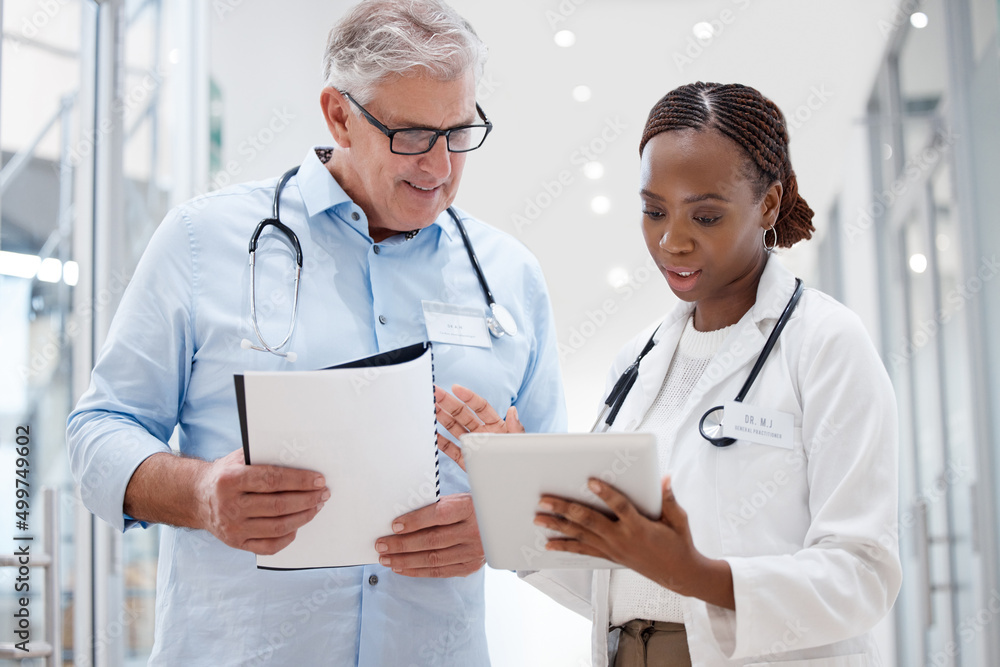 Poster you have some great ideas. shot of two doctors discussing a patients results.