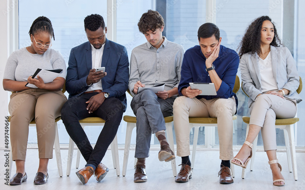 Poster theres nothing to do but wait. shot of a group of businesspeople sitting in line in an office.
