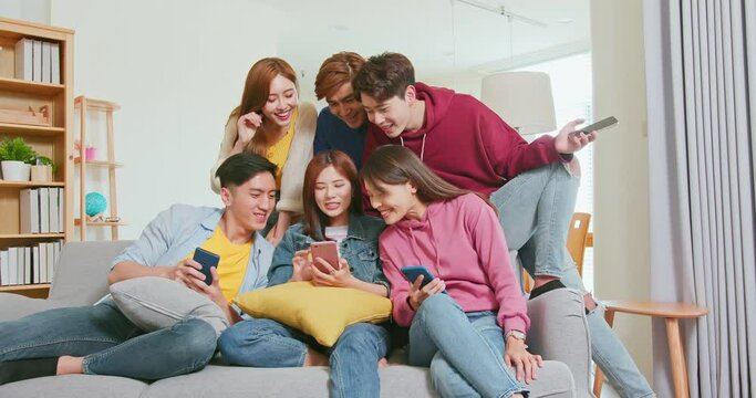 friends use phone laugh