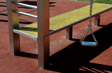 fitness sports fields with stainless steel tools resemble torture tools with chains and handles....