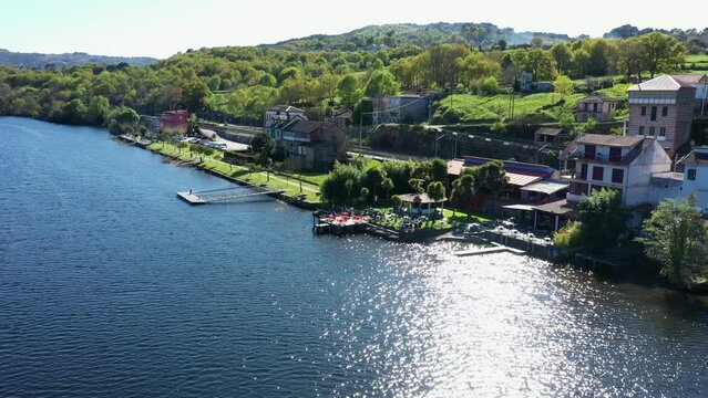 Bar with Sunny Terrace next River Mi&ntilde;o, Cinematic Aerial View.