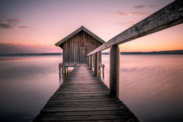 Obraz na płótnie Canvas Traditional boathouse at lake Ammersee near Munich, Bavaria, Germany at sunrise.