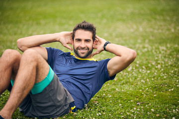 Theres nothing boring about exercise. Shot of a sporty man doing sit-ups.