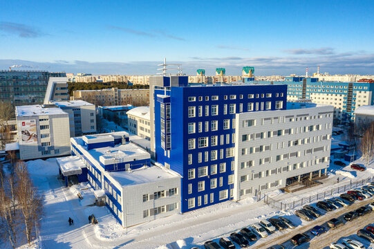 Surgut city in winter. Buildings of the district Clinical Hospital. Aerial view.