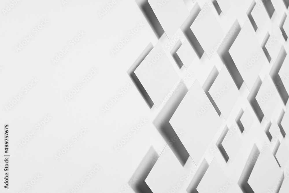 Poster geometric abstract background with flying rhombuses in bright light with contrast dark shadows as bo