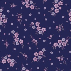 Floral pattern with tiny flowers on dark background.