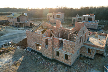 Industrial building site in rural area with residential houses under construction for future sale...