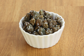 Salted marinated capers snack appetiser