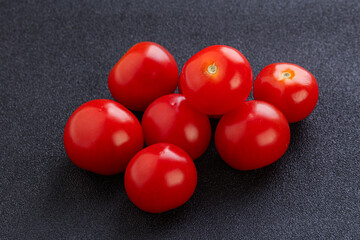 Ripe juicy cherry tomatoes heap