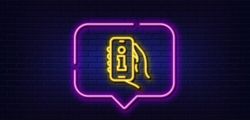 Neon light speech bubble. Info app line icon. Hand hold phone sign. Cellphone with screen notification symbol. Neon light background. Info app glow line. Brick wall banner. Vector