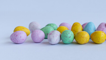 Easter banner. Colored Easter eggs. Bright Easter. Chocolate eggs. Sweets.