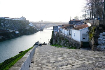 Panorama of Porto with buildings over river and famous bridge Ponte Dom Luis I  in background,...