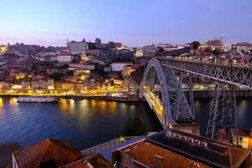 Famous bridge Ponte Dom Luis I  and panorama of Porto in evening scenery, Portugal.