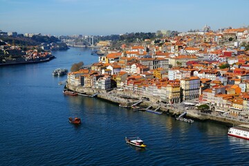 Amazing view of Douro River with boats and panorama of Porto, Portugal