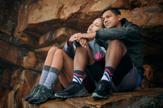 I never realised how beautiful life is until I met you. Shot of a young couple admiring the view while out hiking together.