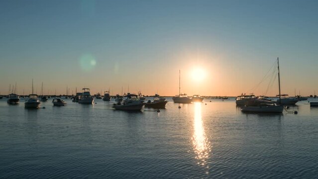 Boats floating in the bay during sunrise timelapse beautiful scenery