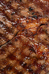 Obraz na płótnie Canvas Closeup on juicy grilled beef steak texture
