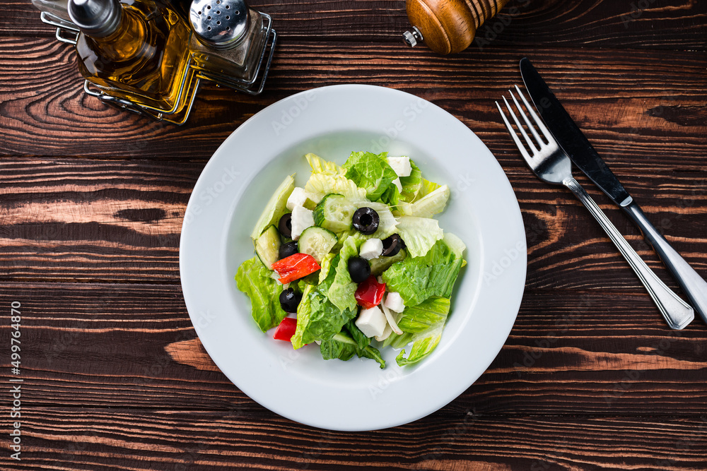 Poster fresh salad with cheese and olives