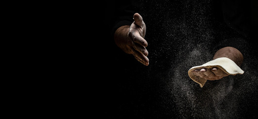 Clap hands of baker with flour. Beautiful and strong men's hands knead the dough make bread, pasta...