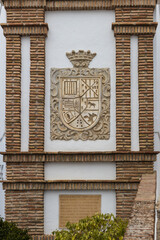 Frigiliana town coat of arms on a building facade