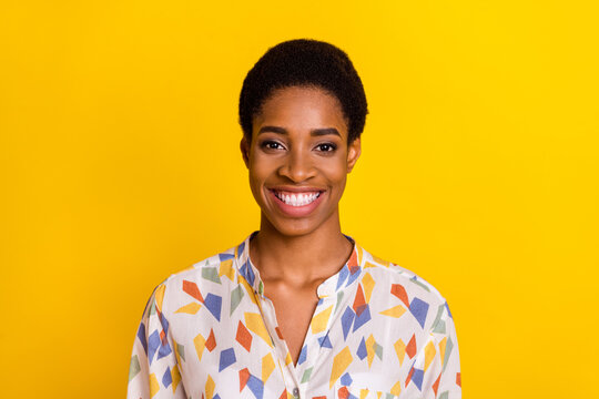 Photo of positive friendly person beaming smile look camera isolated on yellow color background - Powered by Adobe