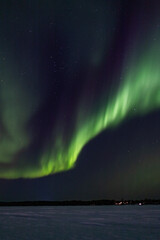 Aurora borealis over the frozen lake
