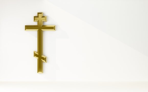 golden orthodox cross on white copy space