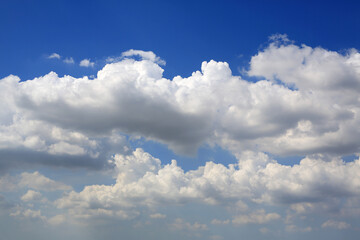 Beautiful blue sky with white fluffy cloud background