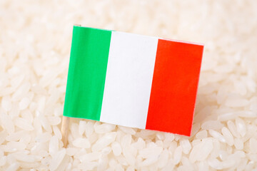 Flag of Italy on white rice. Origin of cereal, agribusiness concept, export, import of rice