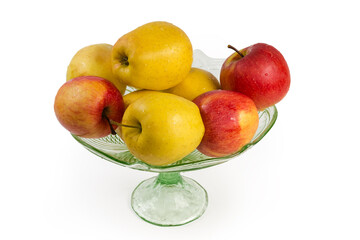 Washed yellow and red apples in vintage vase for fruits