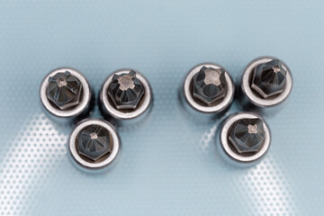 Tips of interchangeable crosspoint bits for screwdriver, top view close-up