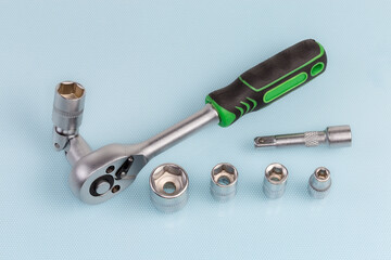 Ratchet wrench with different hexagonal sockets and adapters