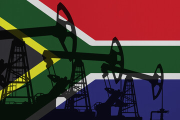 Pump- jacks on background in colors of national flag. Oil and gas wells production concept. South Africa