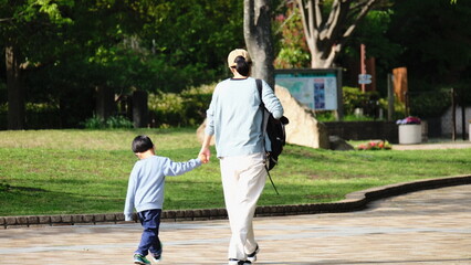 Motheer and child walking in the park
