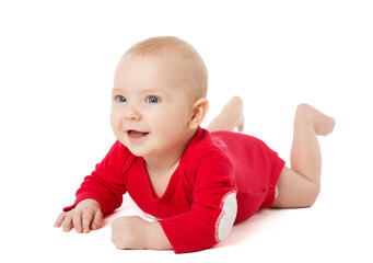 Happy Smiling Baby lying on Stomach over White Background in Cotton Bodysuit. Infant four month Child in Red long Sleeve Babies Onesies crawling. Active Baby Boy isolated looking forward