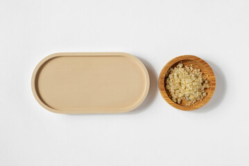 Oval podium, white background. Natural skin care, SPA design. Mineral organic oil. Mock-Up. Flat lay, Top View. Product presentation. Aroma beauty sea salt. Cosmetic product, minimal trend