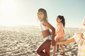 Fototapeta premium Adorable little kids running together at the beach