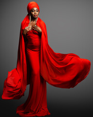 African Woman in Red Dress and Silk Headscarf. Fashion Black Skin Lady in Muslim Abaya Hijab and...