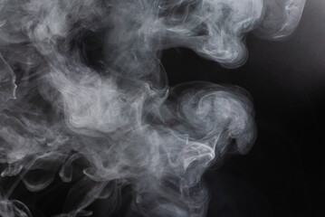 White steam on a black background.